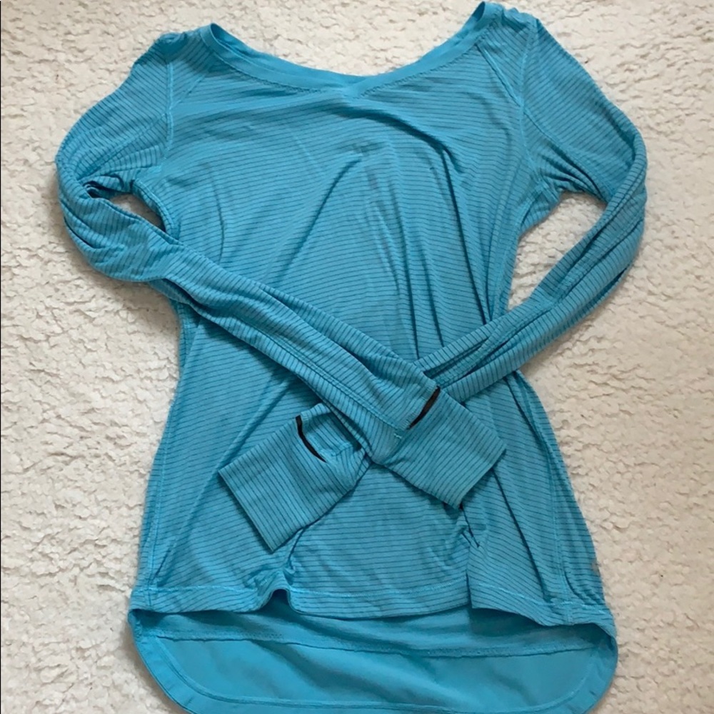 Women’s blue and grey striped workout long sleeve.
